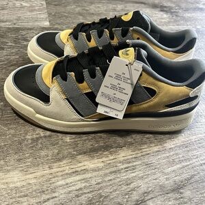 Adidas Black and Yellow Athletic Shoes with Classic Design